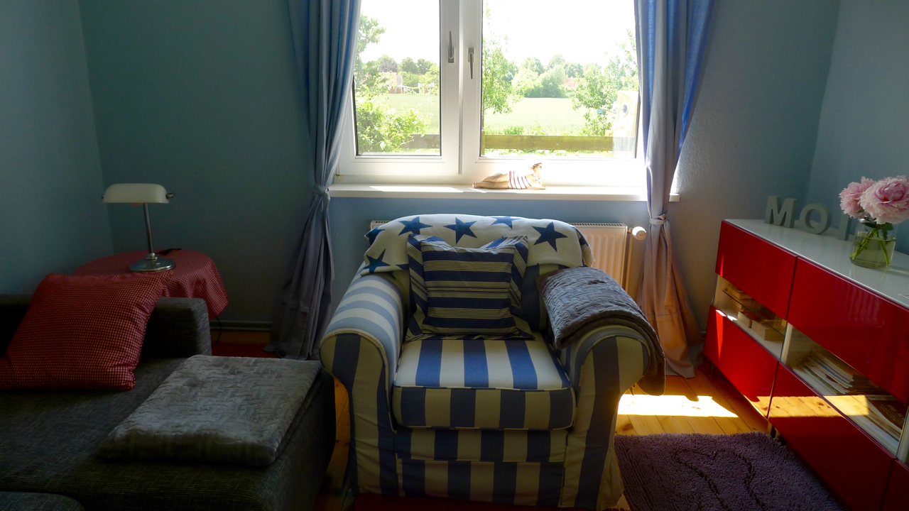 Villa Bootsybunt Wohnung Bootsy Wohnzimmer mit Sessel
